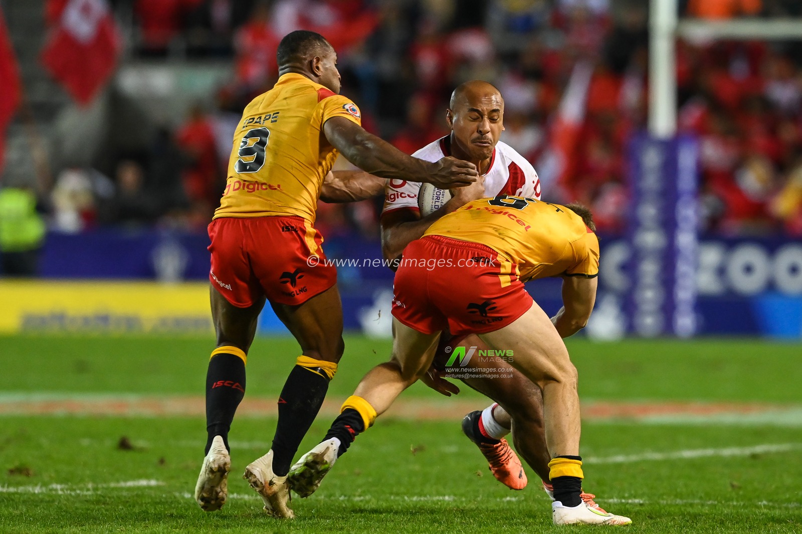 Felise Kaufusi of Tonga is tackled by Kyle Laybutt and Edwin Ipape of Papua New Guinea during the Rugby League World Cup 2021 match Tonga vs Papua New Guinea at Totally Wicked Stadium, St Helens, United Kingdom, 18th October 2022

(Photo by Craig Thomas/News Images)