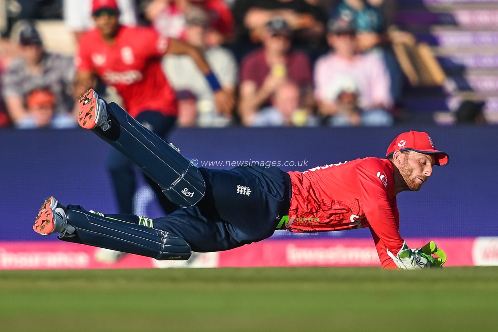 Jos Buttler of England catches the ball to save the single