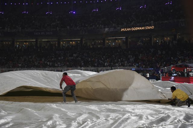 The ground staff work to keep the pitch dry as play is tries to stop the ball due to rain during the 2025 IPL match between Kolkata Knight Riders and Punjab Kings at Eden Gardens on April 26, 2025, in Kolkata, India. Photo by Debajyoti Chakraborty.(Photo: Debajyoti Chakraborty/News Images)