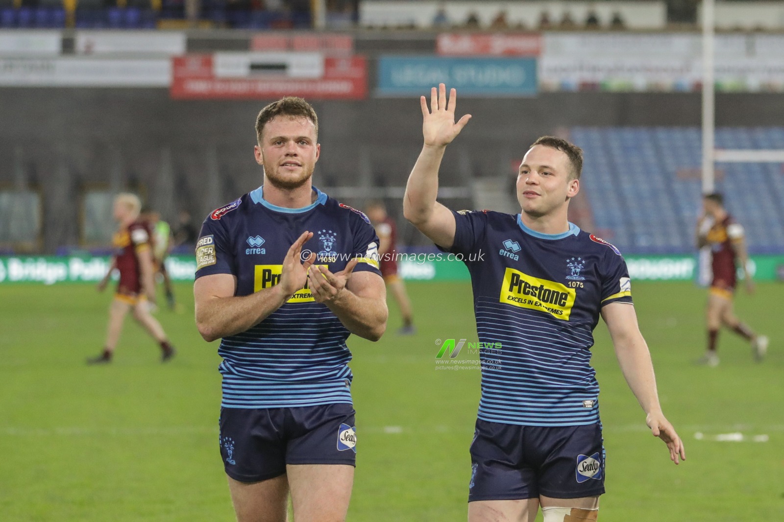 21st June 2019 , John Smiths Stadium, Huddersfield, England; Betfred Super League, Round 19, Huddersfield Giants vs Wigan Warriors ; Joe Burgess (5) of Wigan Warriors and Liam Marshal (17) of Wigan Warriors applaud the traveling fans as Wigan win 


Credit Mark Cosgrove/News Images