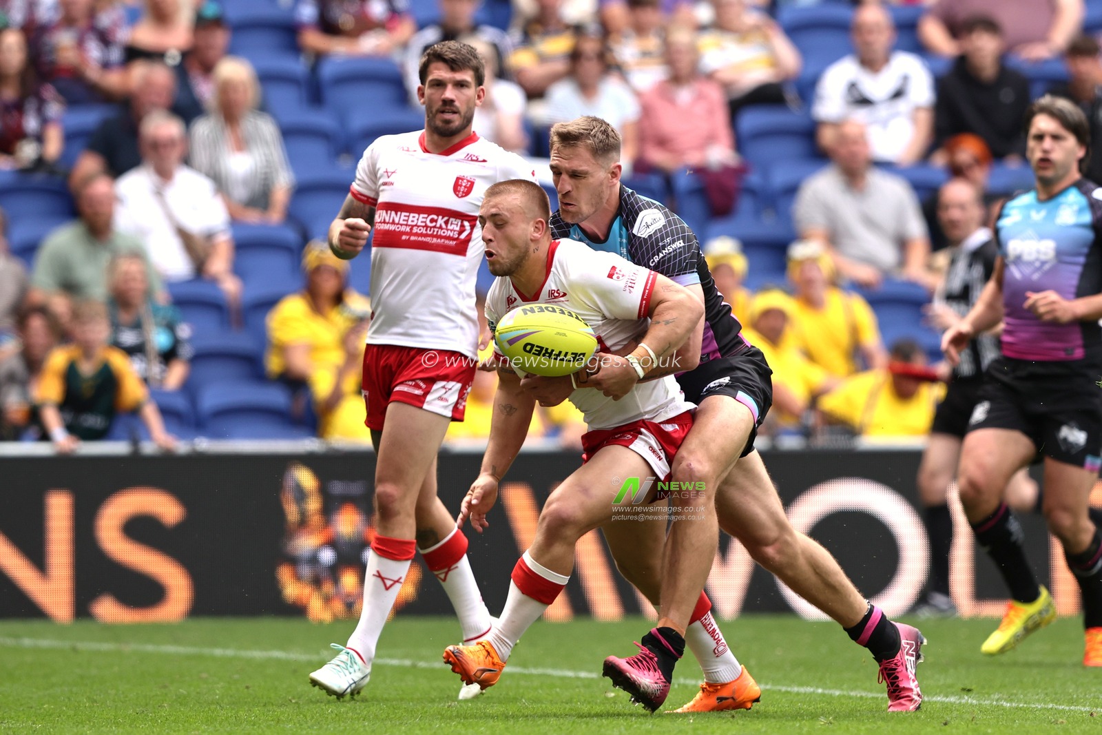 Mikey Lewis of Hull KR is tackled by Jed Cartwright of Hull FC during the Betfred Super League Magic Weekend match Hull KR vs Hull FC at Hill Dickinson Stadium, Liverpool, United Kingdom on 04 July 2026

(Photo by Alfie Cosgrove/News Images)