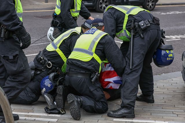 Protestors are detained by the police during an anti-racism protest, Barnsley, United Kingdom, 8th August 2024