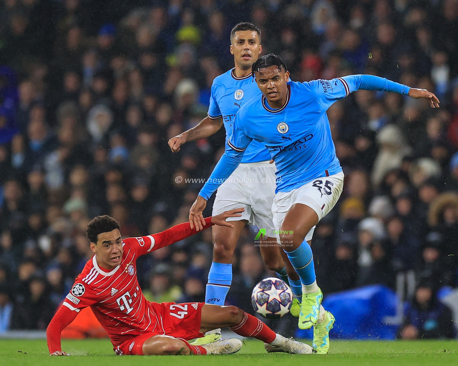 Manuel Akanji #25 of Manchester City evades the challenge of Jamal Musiala #42 of Bayern Munich during the UEFA Champions League Quarter-Finals 1st Leg Manchester City vs Bayern Munich at Etihad Stadium, Manchester, United Kingdom, 11th April 2023

(Photo by Conor Molloy/News Images)