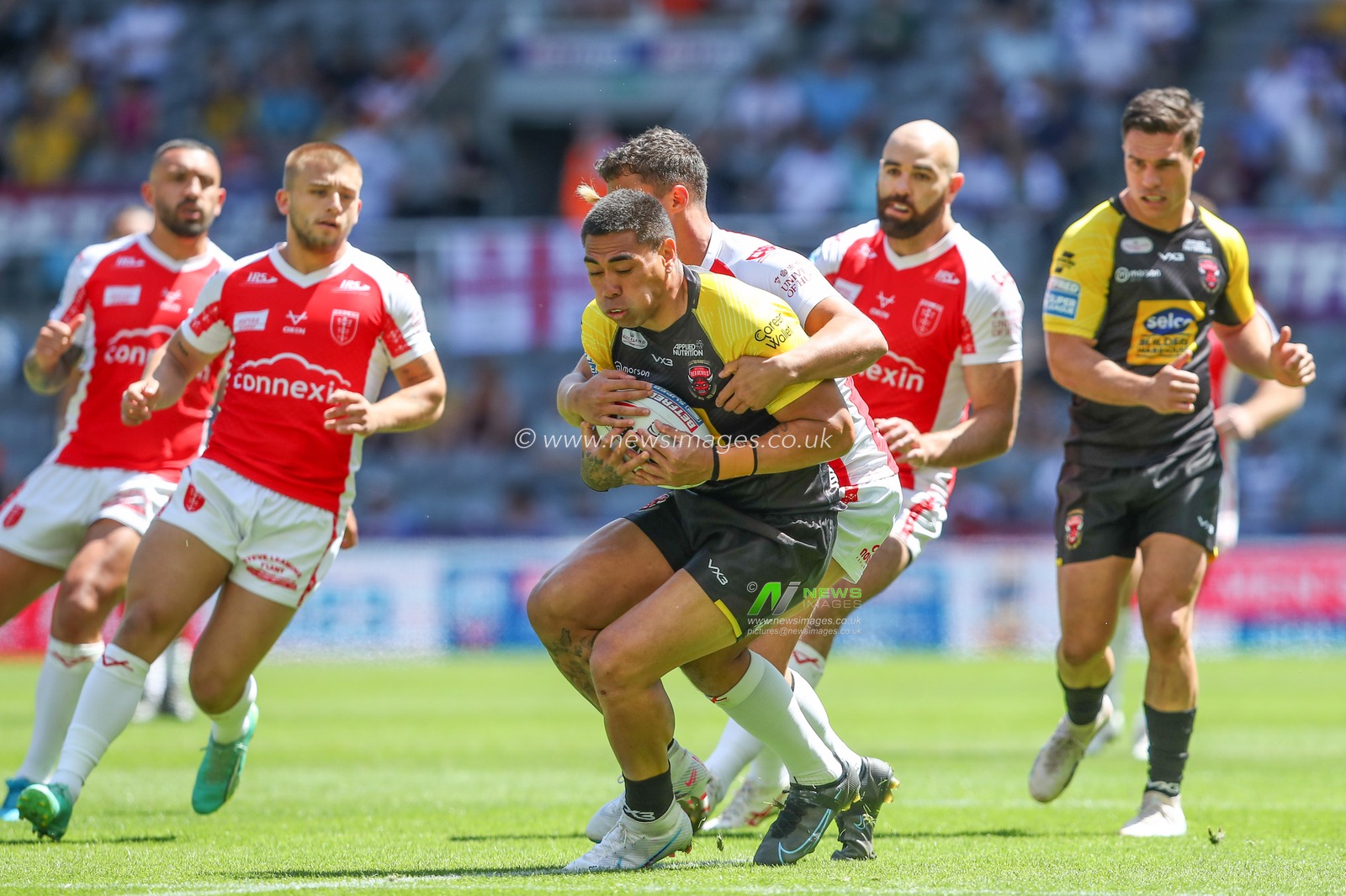 Ken Sio #2 of Salford Red Devils is tackled by Corey Hall #33 of Hull KR during the Betfred Super League Magic Weekend match Salford Red Devils vs Hull KR at St. James's Park, Newcastle, United Kingdom, 3rd June 2023

(Photo by Gareth Evans/News Images)