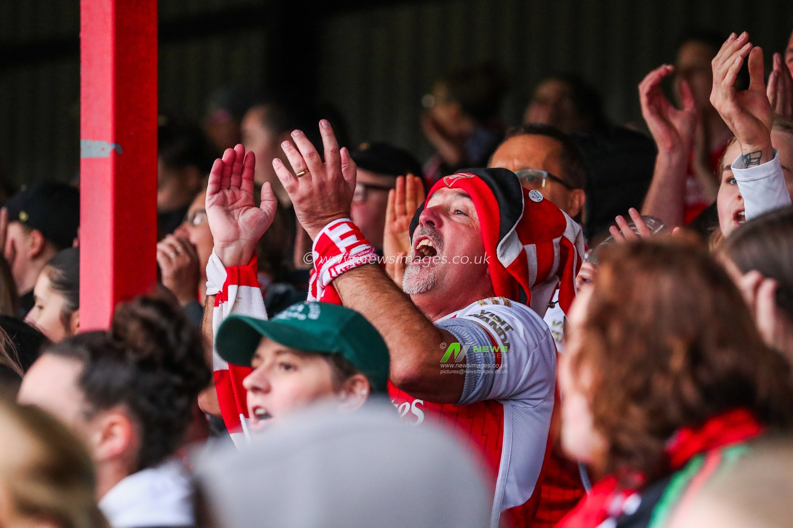 Arsenal fans celebrate the teams victory following the Barclays Women's Super League match West Ham United Women vs Arsenal Women at Chigwell Construction Stadium, Dagenham, United Kingdom, 20th October 2024

(Photo by Izzy Poles/News Images)