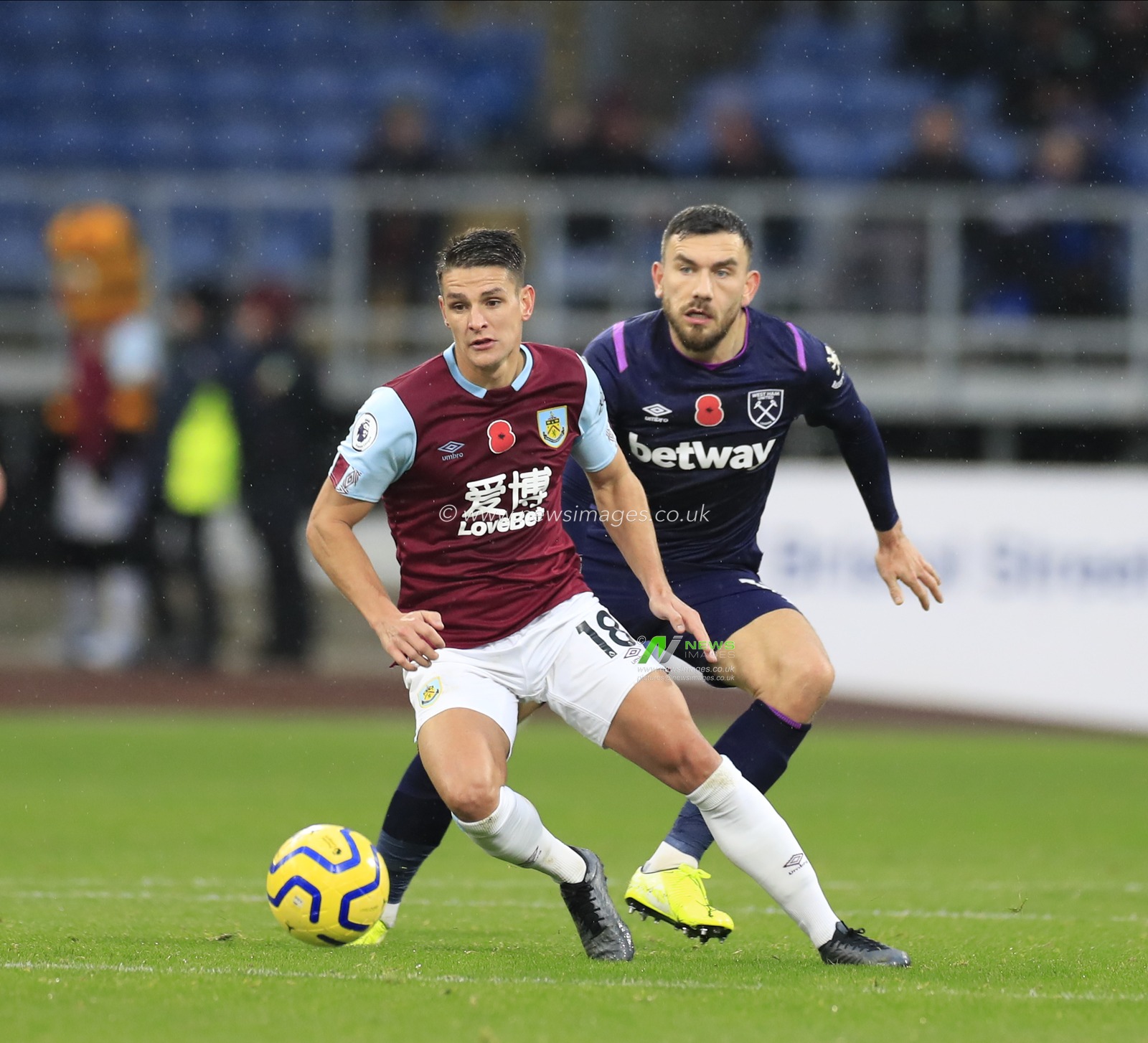 9th November 2019, Turf Moor, Burnley, England; Premier League, Burnley v West Ham United : Ashley Westwood (18) of Burnley runs clear of Robert Snodgrass (11) of West Ham United
 
Credit: Conor Molloy/News Images