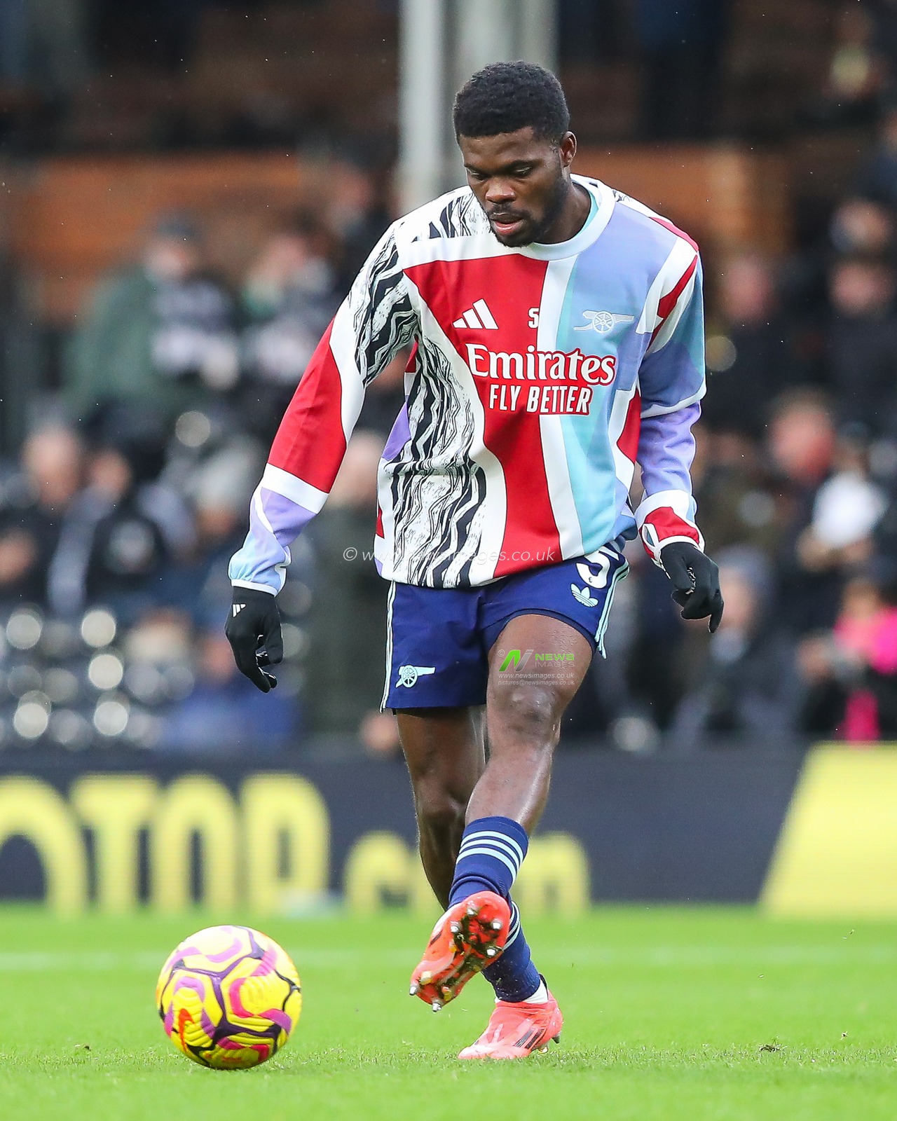Thomas Partey of Arsenal passes the ball during the pre-game warmup ahead of the Premier League match Fulham vs Arsenal at Craven Cottage, London, United Kingdom, 8th December 2024

(Photo by Gareth Evans/News Images)