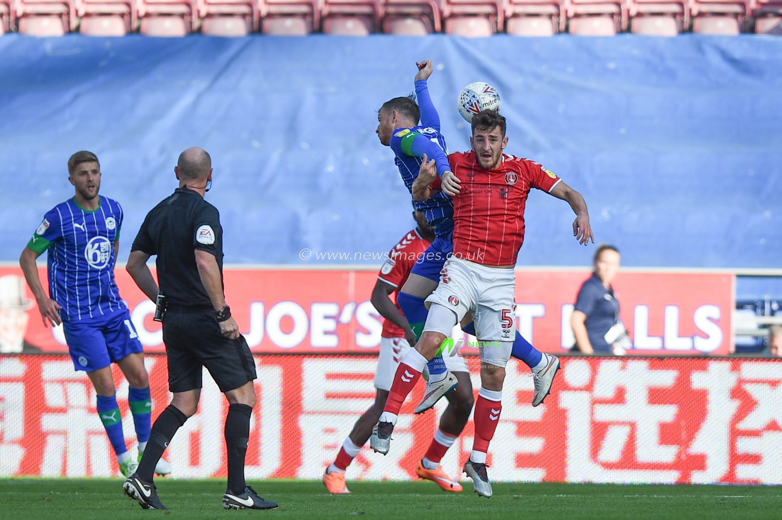 21st September 2019, DW Stadium, Wigan, England; Sky Bet Championship Football, Wigan Athletic vs Charlton Athletic ; Joe Garner (14) of Wigan Athletic and Tom Lockyer (5) of Charlton Athletic go up for the header


Credit: Richard Long/News Images

English Football League images are subject to DataCo Licence