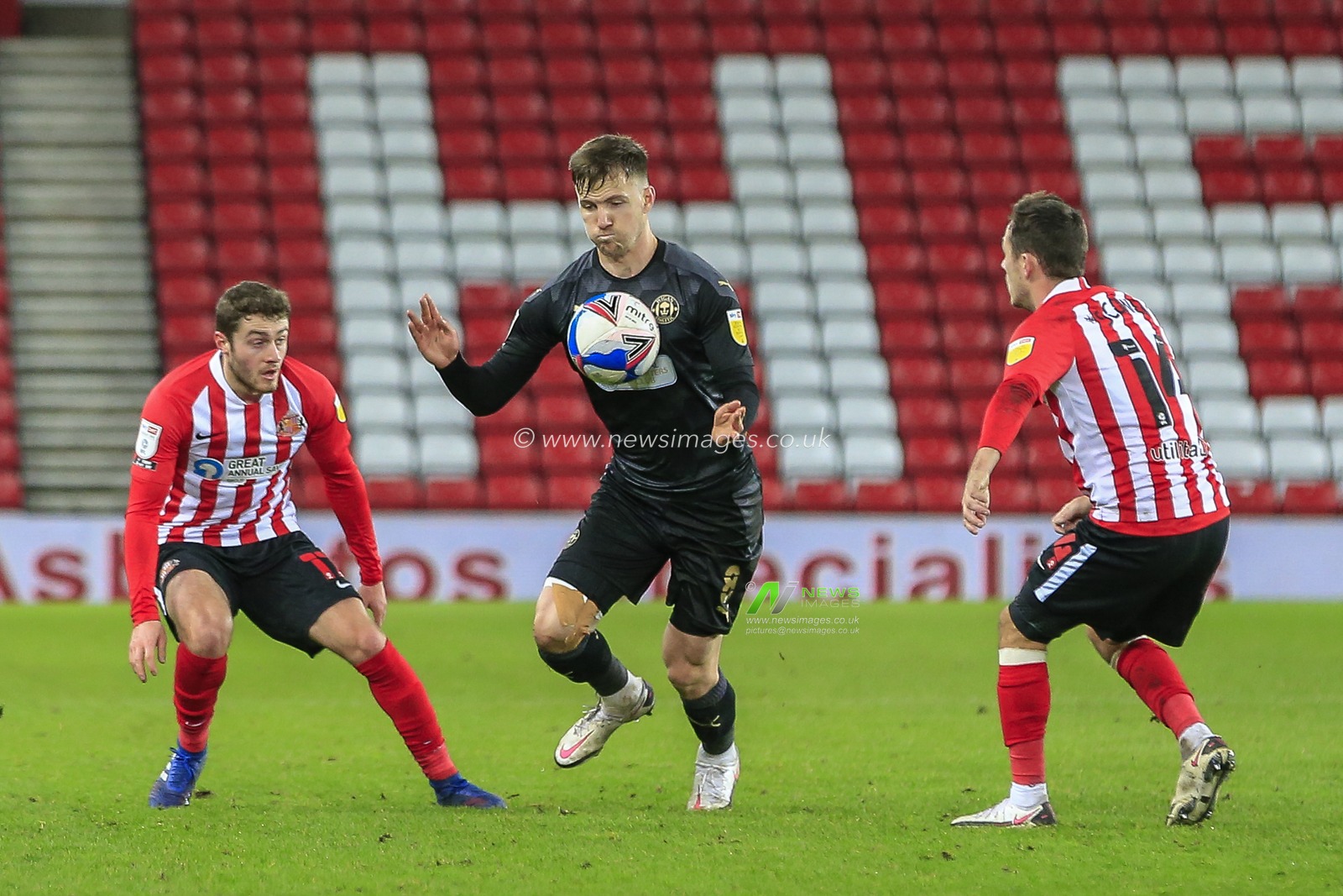 Lee Evans #8 of Wigan Athletic controls the ball with his chest