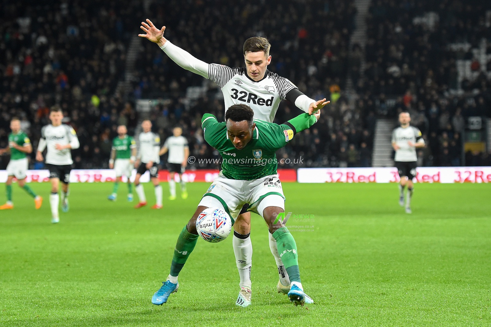 11th December 2019, Pride Park Stadium, Derby, England; Sky Bet Championship, Derby County v Sheffield Wednesday : Moses Odubajo (22) of Sheffield Wednesday holds off Tom Lawrence (10) of Derby County 

Credit: Jon Hobley/News Images