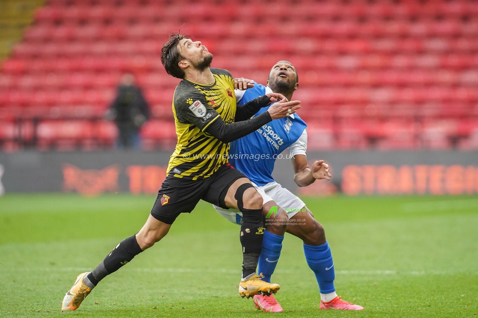 Kiko Femenia #21 of Watford and Jeremie Bela #11 of Birmingham City keep their eyes on the ball