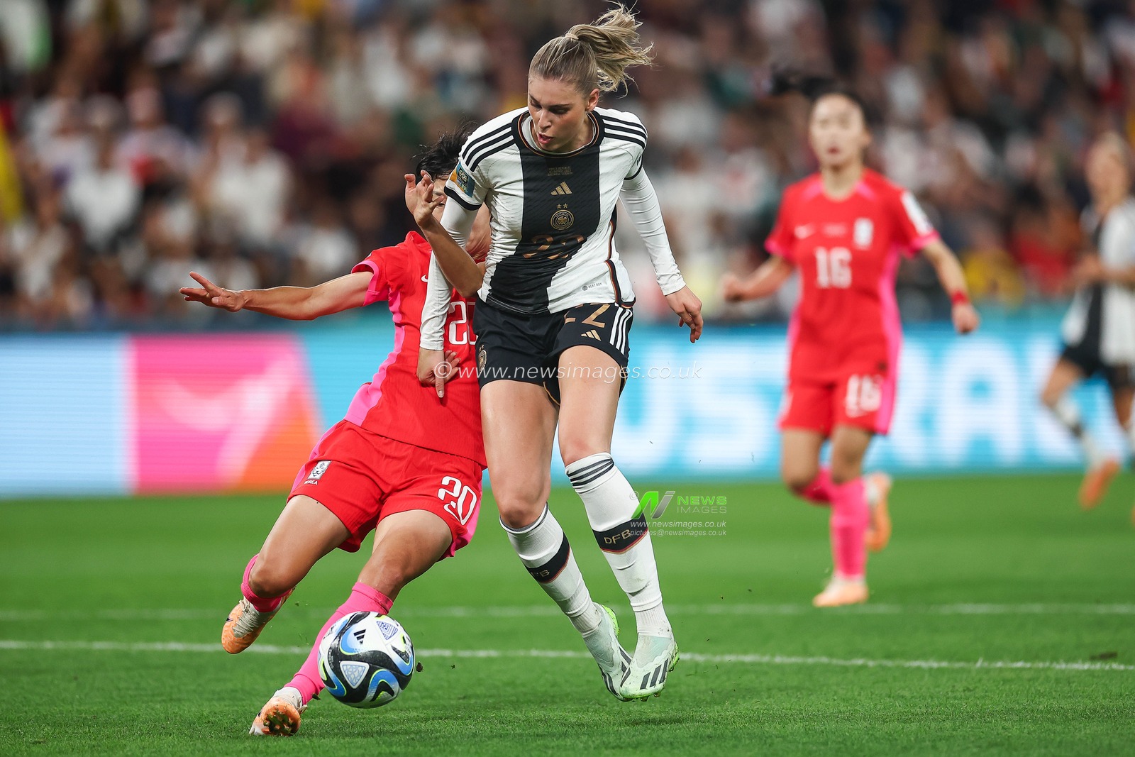 Jule Brand #22 of Germany is tackled by Kim Hye-ri #20 of South Korea during the FIFA Women's World Cup 2023 Group H South Korea Women vs Germany Women at Adelaide Oval, Adelaide, Australia, 3rd August 2023

(Photo by Patrick Hoelscher/News Images)