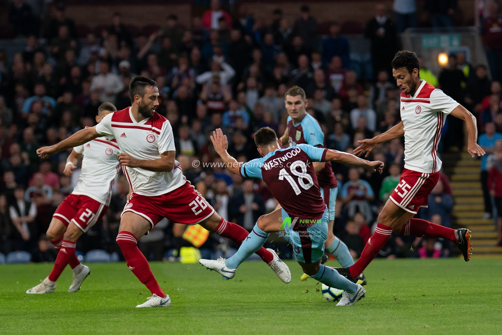 Burnley's Ashley Westwood under pressure as he shoots at goal

30th August 2018, Turf Moor, Burnley, England; UEFA Europa League, Play off leg 2 of 2, Burnley v Olympiacos FC