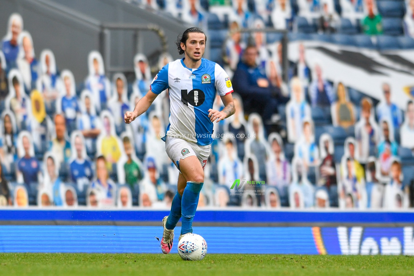 Lewis Travis (27) of Blackburn Rovers runs forward with the ball