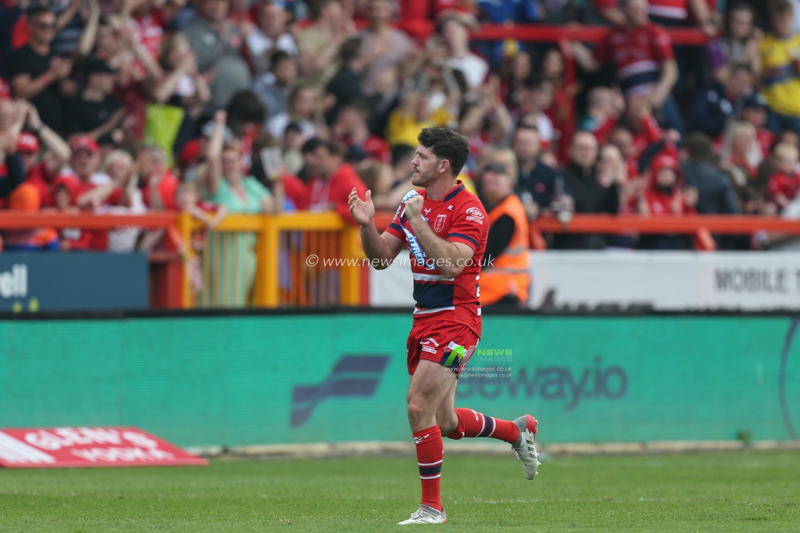 Lachlan Coote #1 of Hull KR runs around the pitch applauding the Hull KR fans after being interviewed by SKY Sports