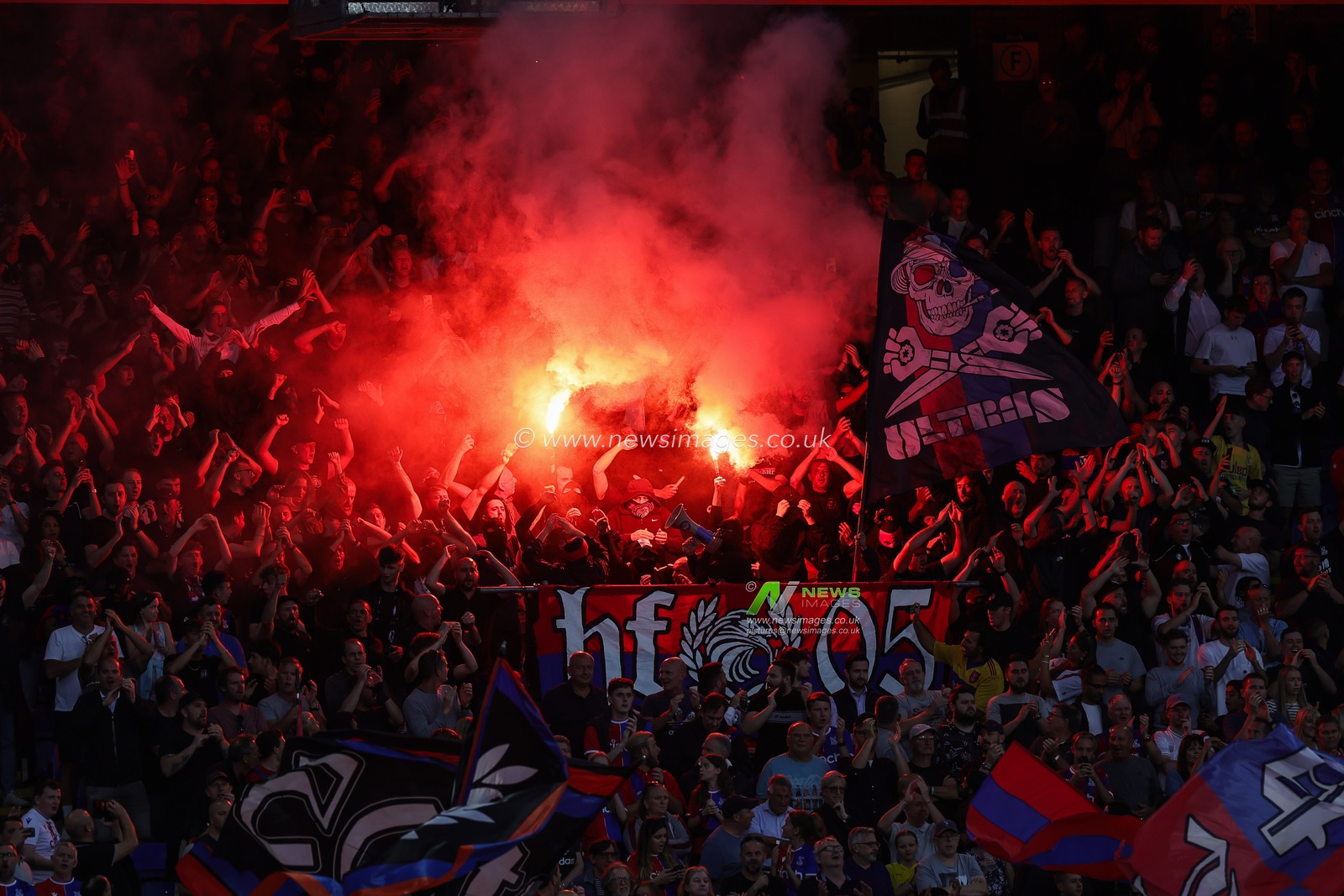 Crystal Palace fans let of a flare in the stand during the Premier League match Crystal Palace vs Arsenal at Selhurst Park, London, United Kingdom, 21st August 2023

(Photo by Mark Cosgrove/News Images)