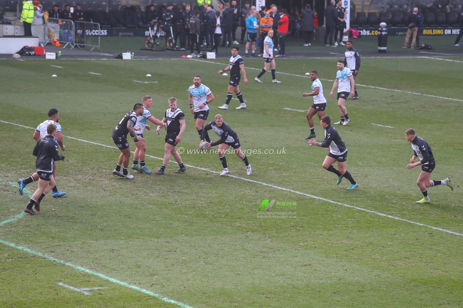 Hull FC players warm up prior to the kick off