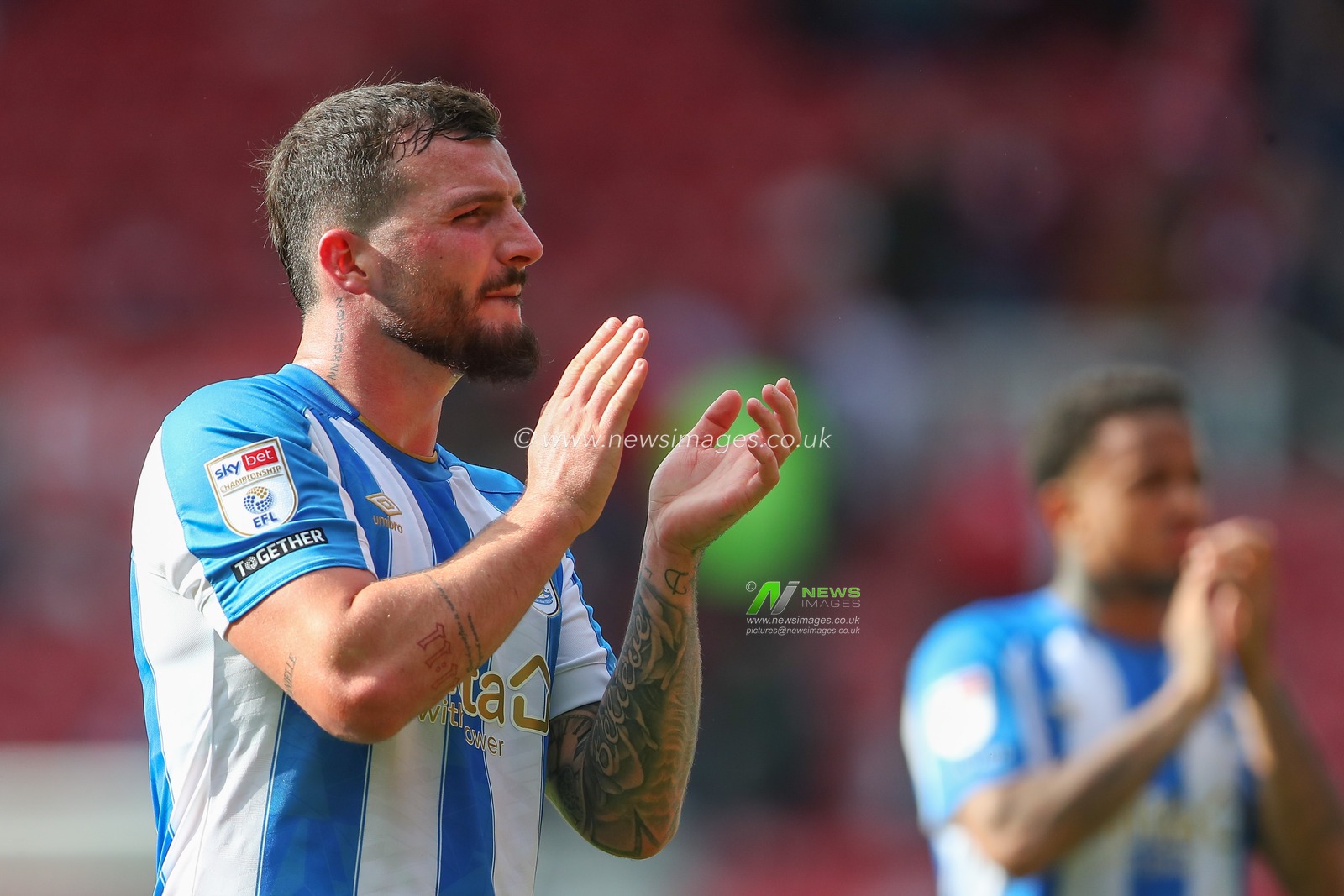 Tom Edwards #16 of Huddersfield Town applauds the travelling fans after the Sky Bet Championship match Middlesbrough vs Huddersfield Town at Riverside Stadium, Middlesbrough, United Kingdom, 19th August 2023

(Photo by Gareth Evans/News Images)