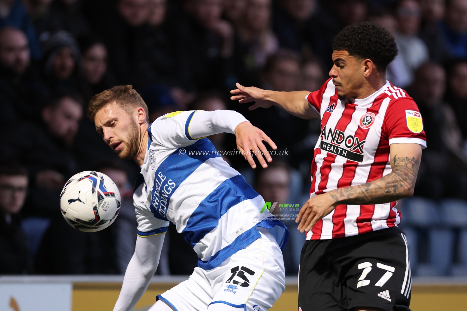 Morgan Gibbs-White of Sheffield United challenges Sam Field of Queens Park Rangers.