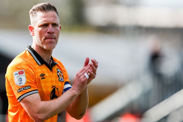 Michael Morrison of Cambridge United acknowledges the fans prior to the Sky Bet League 1 match Cambridge United vs Peterborough United at Cledara Abbey Stadium, Cambridge, United Kingdom, 15th March 2025

(Photo by Izzy Poles/News Images)