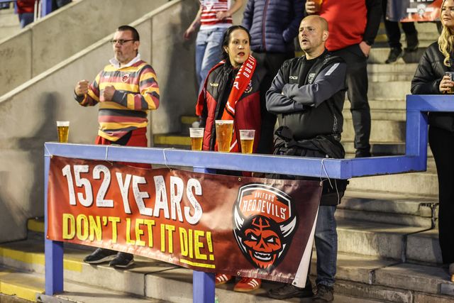Salford fans protest against their clubs owners during the Betfred Super League Round 24 match Warrington Wolves vs Salford Red Devils at Halliwell Jones Stadium, Warrington, United Kingdom, 29th August 2025

(Photo by Alfie Cosgrove/News Images)