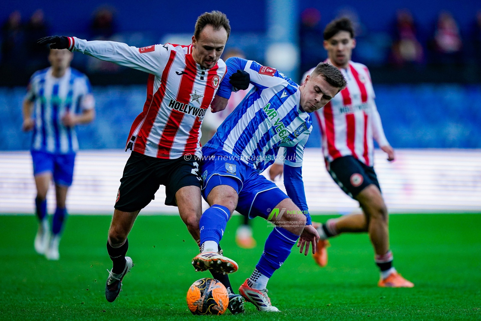 Mikkel Damsgaard of Brentford battles for the ball with Max Lowe of Sheffield Wednesday during the Emirates FA Cup Third Round match Sheffield Wednesday vs Brentford at Hillsborough, Sheffield, United Kingdom, 10th January 2026

(Photo by Maynard Manyowa/News Images)