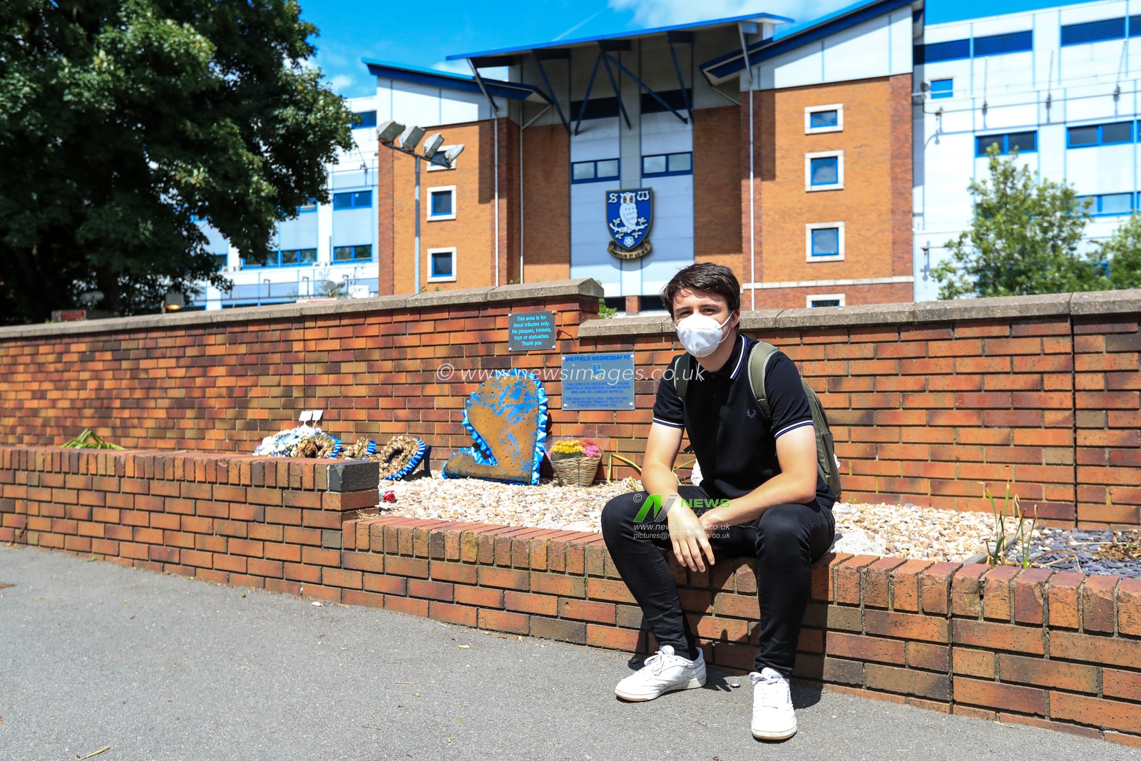 A Sheffield Wednesday fan sits out side Hillsborough