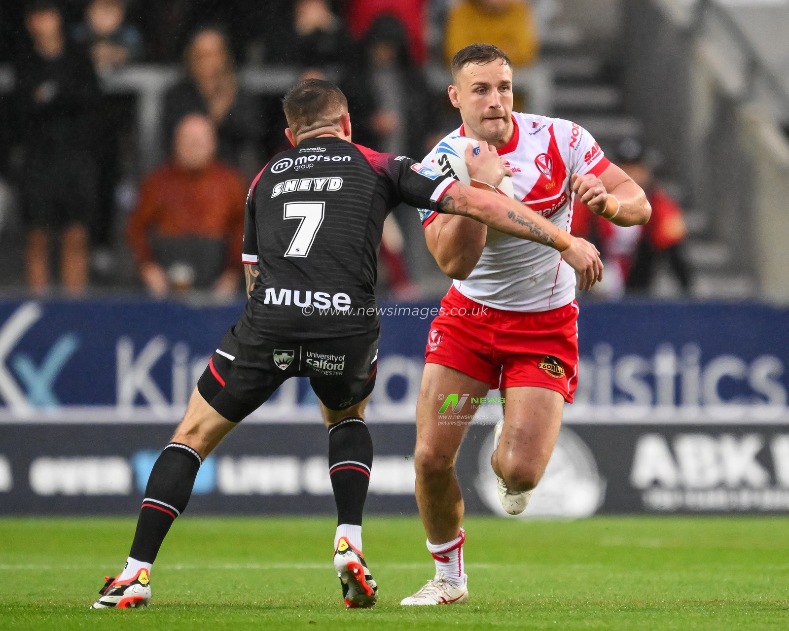 Matty Lees of St. Helens is tackled by Marc Sneyd of Salford Red Devils  during the Betfred Super League Round 21 match St Helens vs Salford Red Devils at Totally Wicked Stadium, St Helens, United Kingdom, 8th August 2024

(Photo by Craig Thomas/News Images)