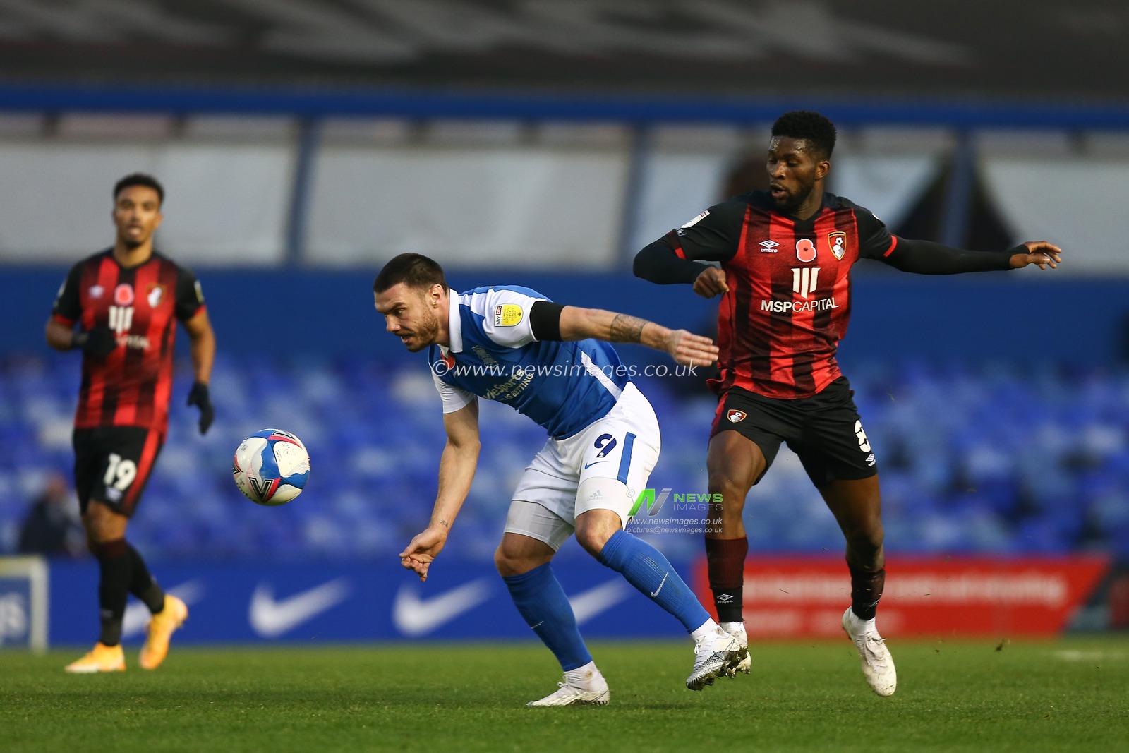 Scott Hogan #9 of Birmingham City is challenged by Jefferson Lerma #8 of Bournemouth