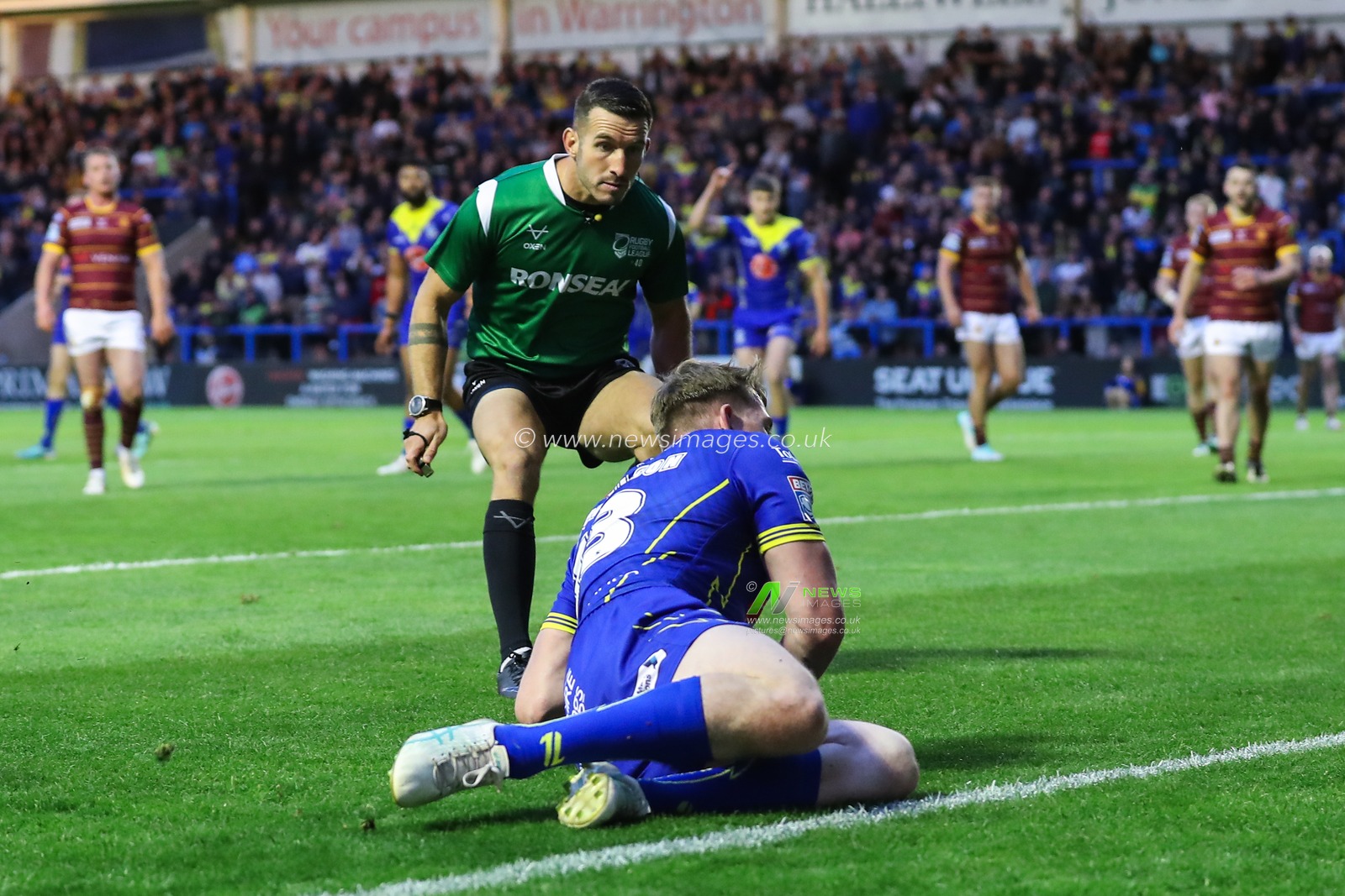 Matty Nicholson of Warrington Wolves goes over for a try and makes the score 28-0 during the Betfred Super League Round 16 match Warrington Wolves vs Huddersfield Giants at Halliwell Jones Stadium, Warrington, United Kingdom, 5th July 2024

(Photo by Gareth Evans/News Images)