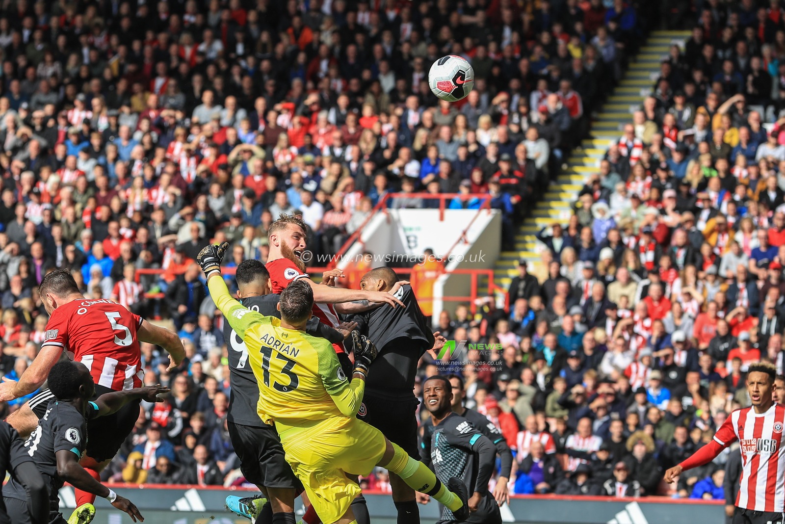 28th September 2019, Bramall Lane, Sheffield, England; Premier League, Sheffield United v Liverpool : Oliver McBurnie (9) of Sheffield United heads on goal but it goes high and over 

Credit: Mark Cosgrove/News Images