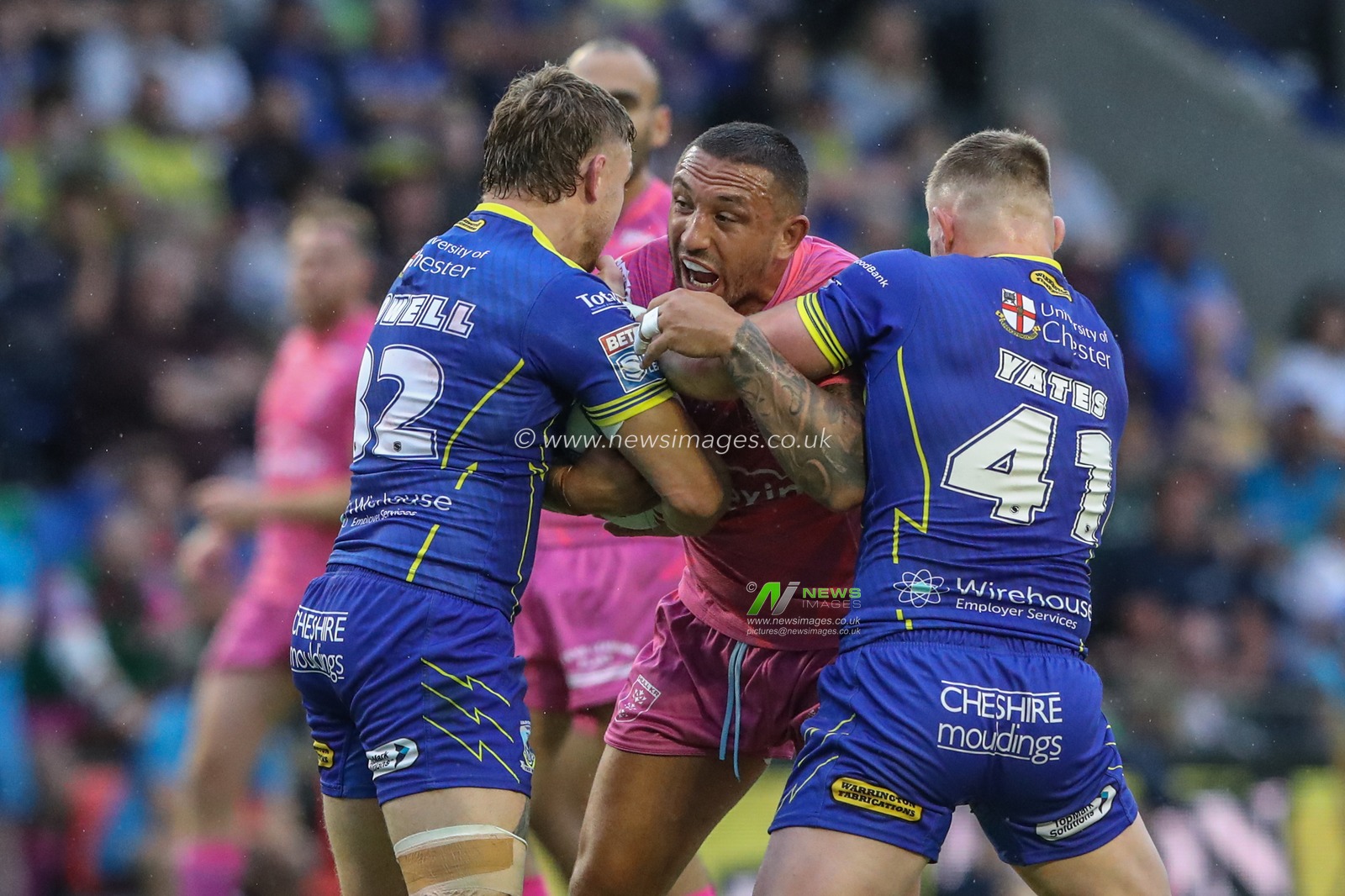 Elliot Minchella of Hull KR is tackled by Sam Powell of Warrington Wolves and Luke Yates of Warrington Wolves during the Betfred Super League Round 20 match Warrington Wolves vs Hull KR at Halliwell Jones Stadium, Warrington, United Kingdom, 2nd August 2024

(Photo by Alfie Cosgrove/News Images)