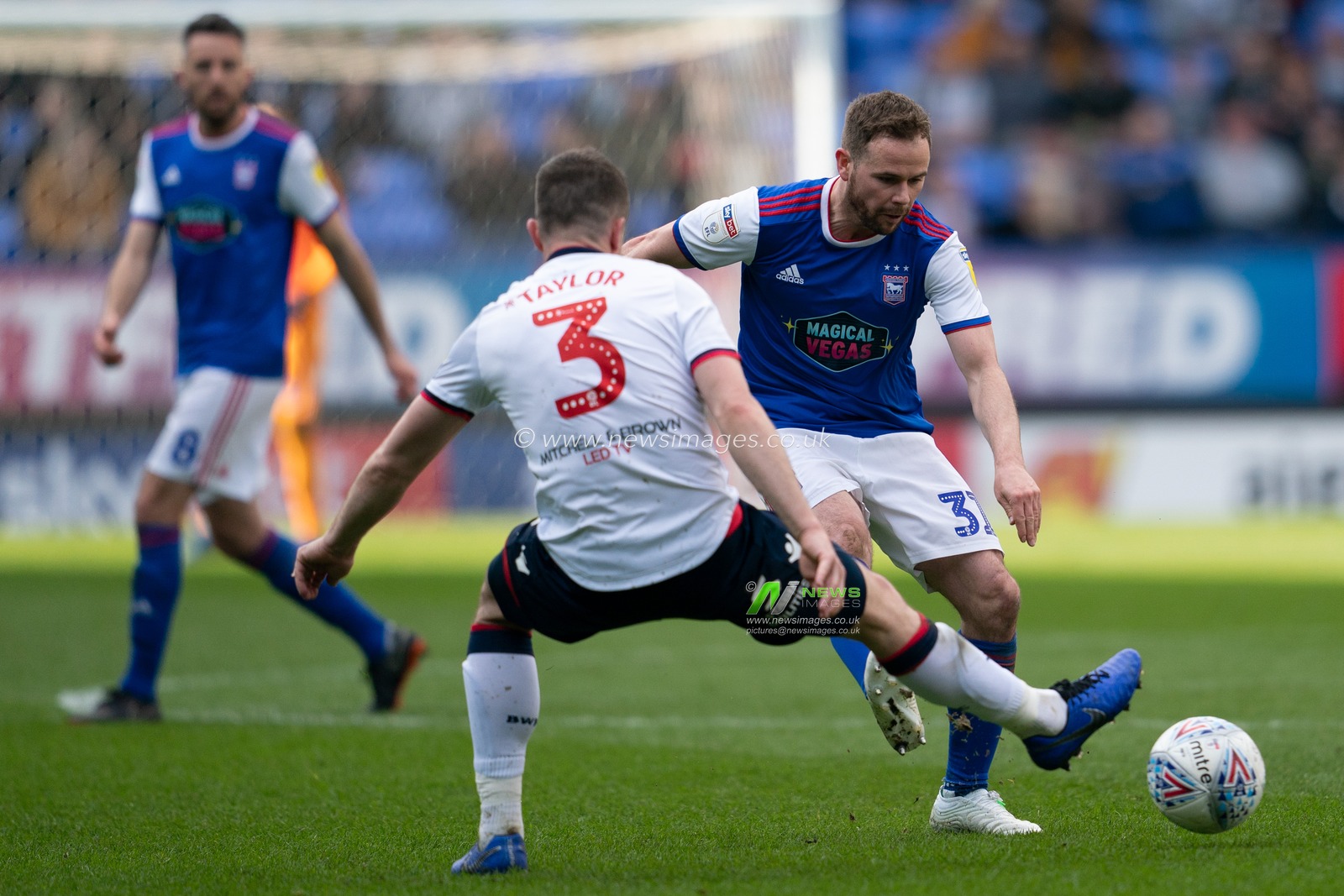 Ipswich Town Alan Judge under pressure from Bolton Wanderers Andrew Taylor

6th April 2019 , University of Bolton Stadium, Bolton, England;  Sky bet Championship Football, Bolton Wanderers vs Ipswich Town 

Credit: Terry Donnelly/News Images