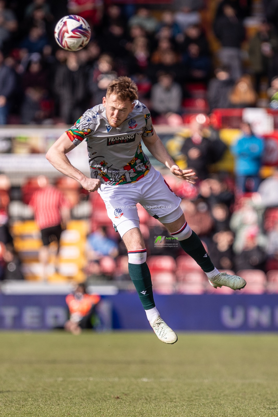 George Johnston of Bolton Wanderers warms up ahead of the Sky Bet League 1 match Wrexham vs Bolton Wanderers at SToK Cae Ras, Wrexham, United Kingdom, 1st March 2025

(Photo by Nik Mesney/News Images)