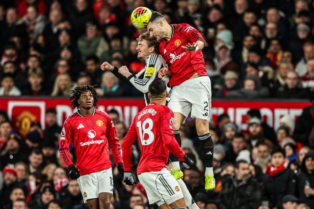 Diogo Dalot of Manchester Untied jumps up to win the high ball from Nick Woltemade of Newcastle United during the Premier League match Manchester United vs Newcastle United at Old Trafford, Manchester, United Kingdom, 26th December 2025

(Photo by Alfie Cosgrove/News Images)

*** GER AUT SUI OUT ***