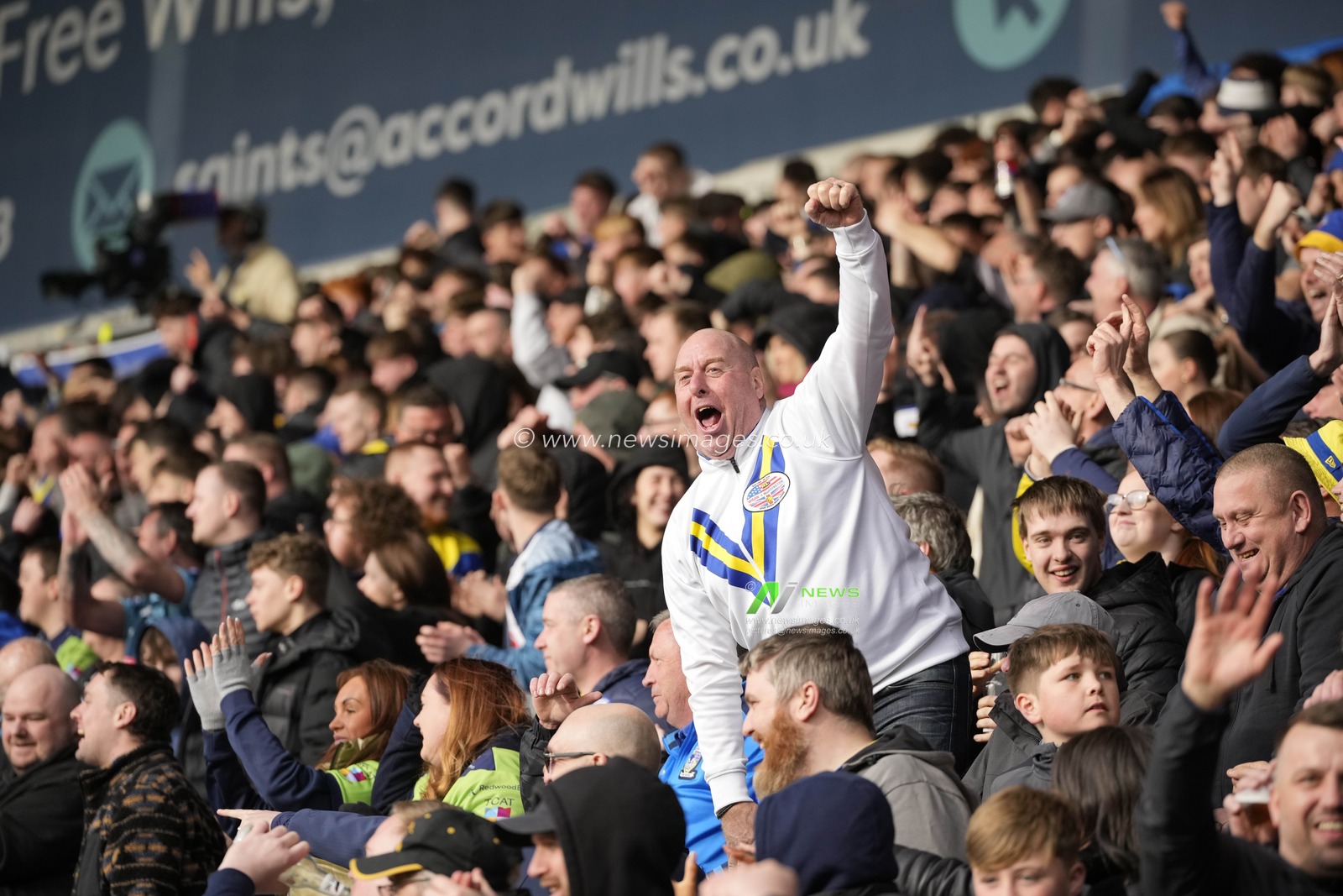 Warrington Wolves fans celebrate their sides 8-31 victory in the Betfred Challenge Cup Quarter Final match St Helens vs Warrington Wolves at Totally Wicked Stadium, St Helens, United Kingdom, 14th April 2024

(Photo by Steve Flynn/News Images)