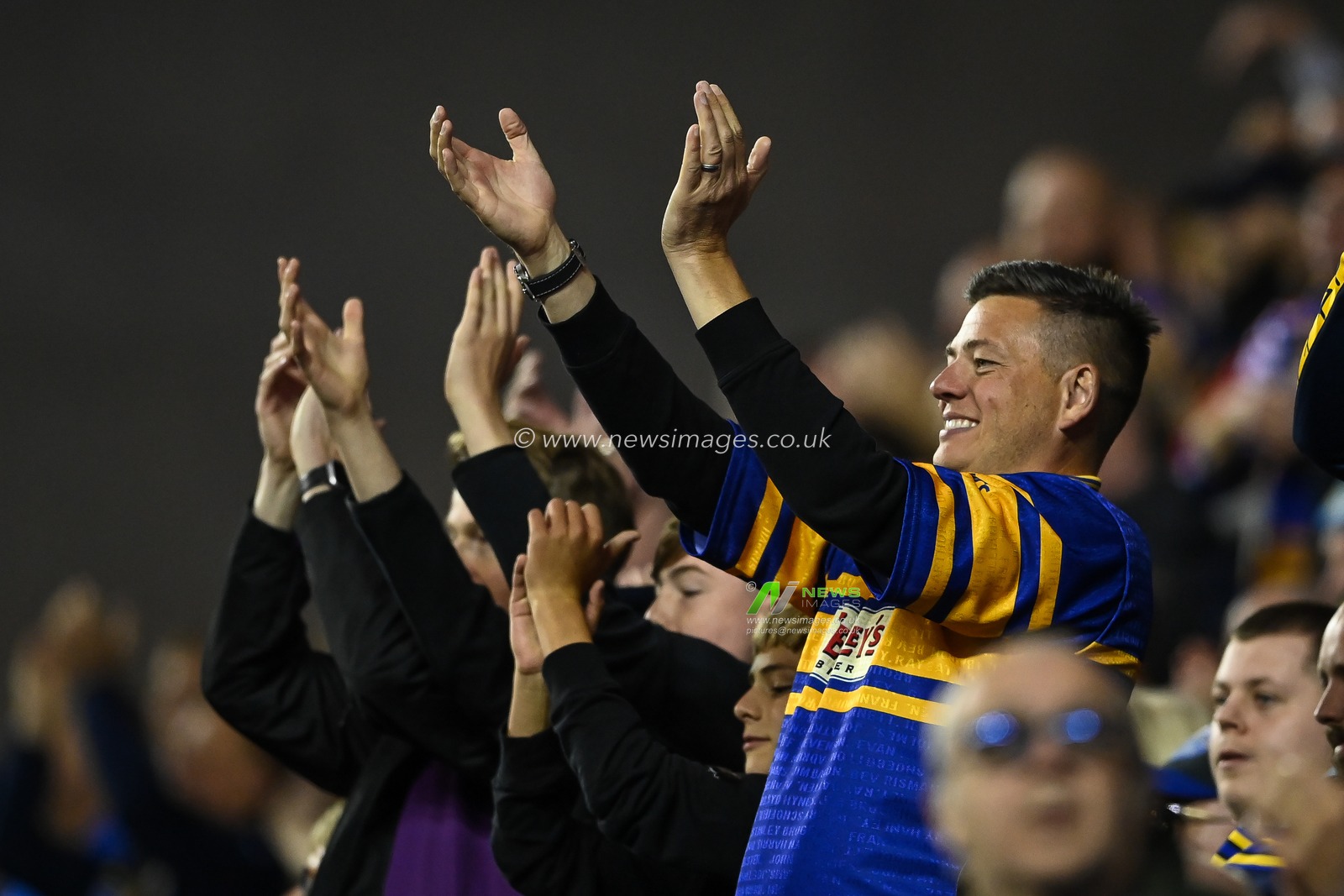 A Leeds fan celebrates during the Betfred Super League match Wigan Warriors vs Leeds Rhinos at DW Stadium, Wigan, United Kingdom, 16th September 2022

(Photo by Craig Thomas/News Images)