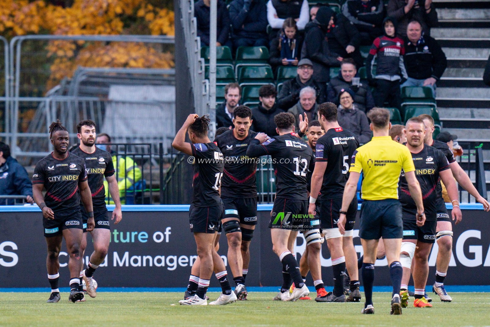 Theo McFarland #6 of Saracens celebrates with his team mates after scoring a try