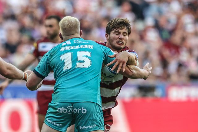 Ethan Havard of Wigan Warriors is tackled by Matty English of Huddersfield Giants during the Betfred Super League round 18 match Wigan Warriors vs Huddersfield Giants at The Brick Community Stadium, Wigan, United Kingdom, 11th July 2025

(Photo by Alfie Cosgrove/News Images)
