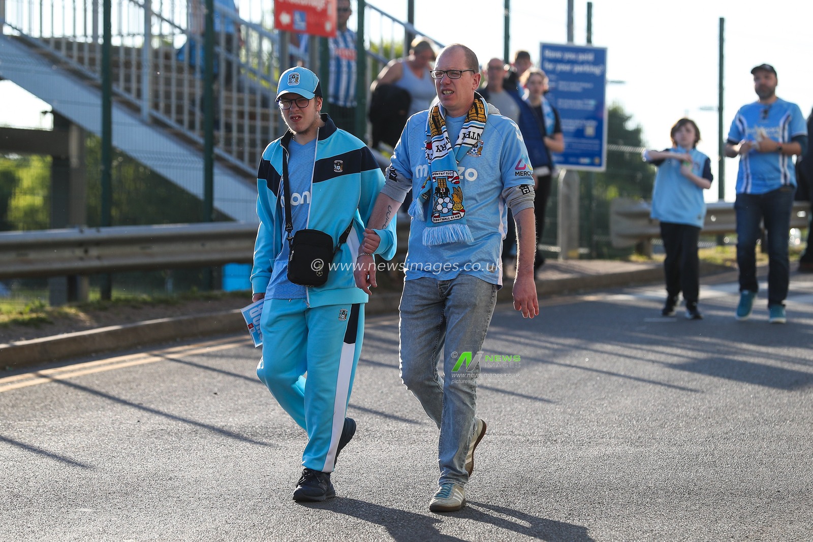 Coventry City fans make their way to the stadium ahead of the Sky Bet Championship Palyoff Semi-final match Coventry City vs Sunderland at Coventry Building Society Arena, Coventry, United Kingdom, 9th May 2025

(Photo by Gareth Evans/News Images)