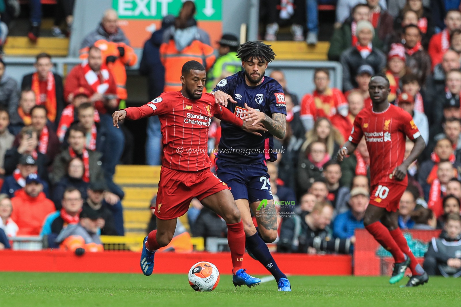 7th March 2020, Anfield, Liverpool, England; Premier League, Liverpool v Bournemouth : Georginio Wijnaldum (5) of Liverpool holds off Philip Billing of Bournemouth
