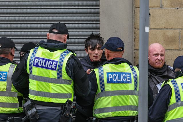 Protestors are detained by the police during an anti-racism protest, Barnsley, United Kingdom, 8th August 2024