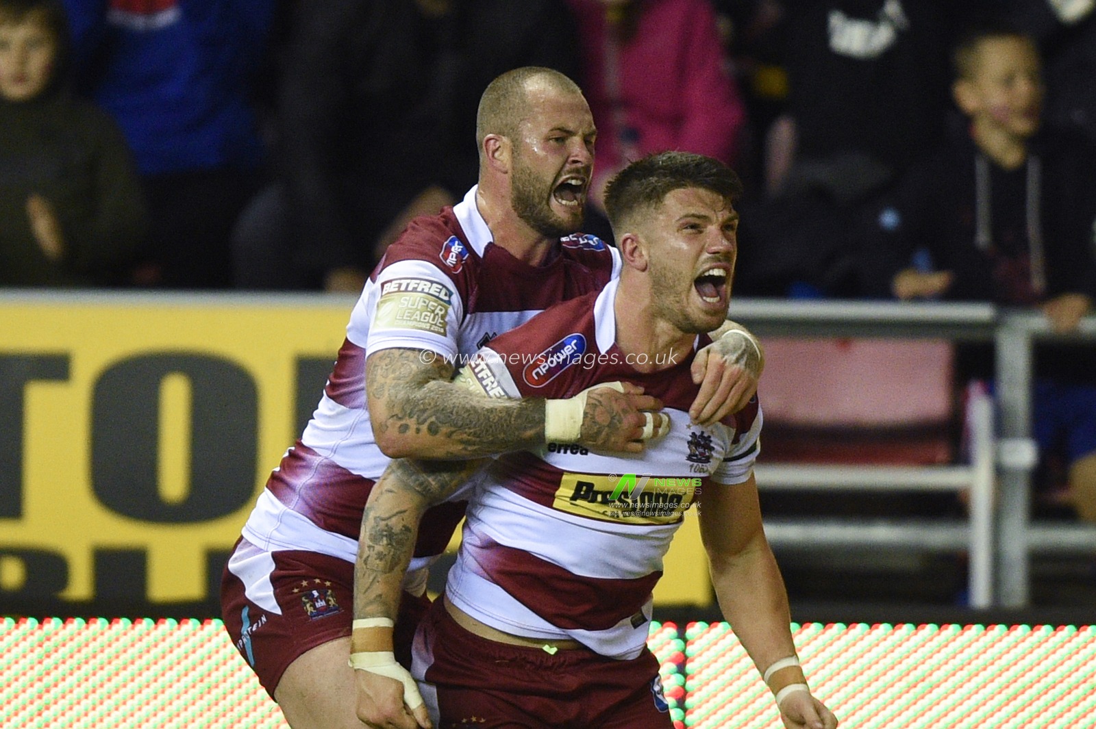 12th September 2019 , DW Stadium, Wigan, England;  Betfred Super League Rugby, Round 29, Wigan Warriors vs Castleford Tigers ; Oliver Gildart (4) of Wigan Warriors celebrates his try with team mate Zak Hardaker (20) of Wigan Warriors 

Credit: Richard Long/News Images