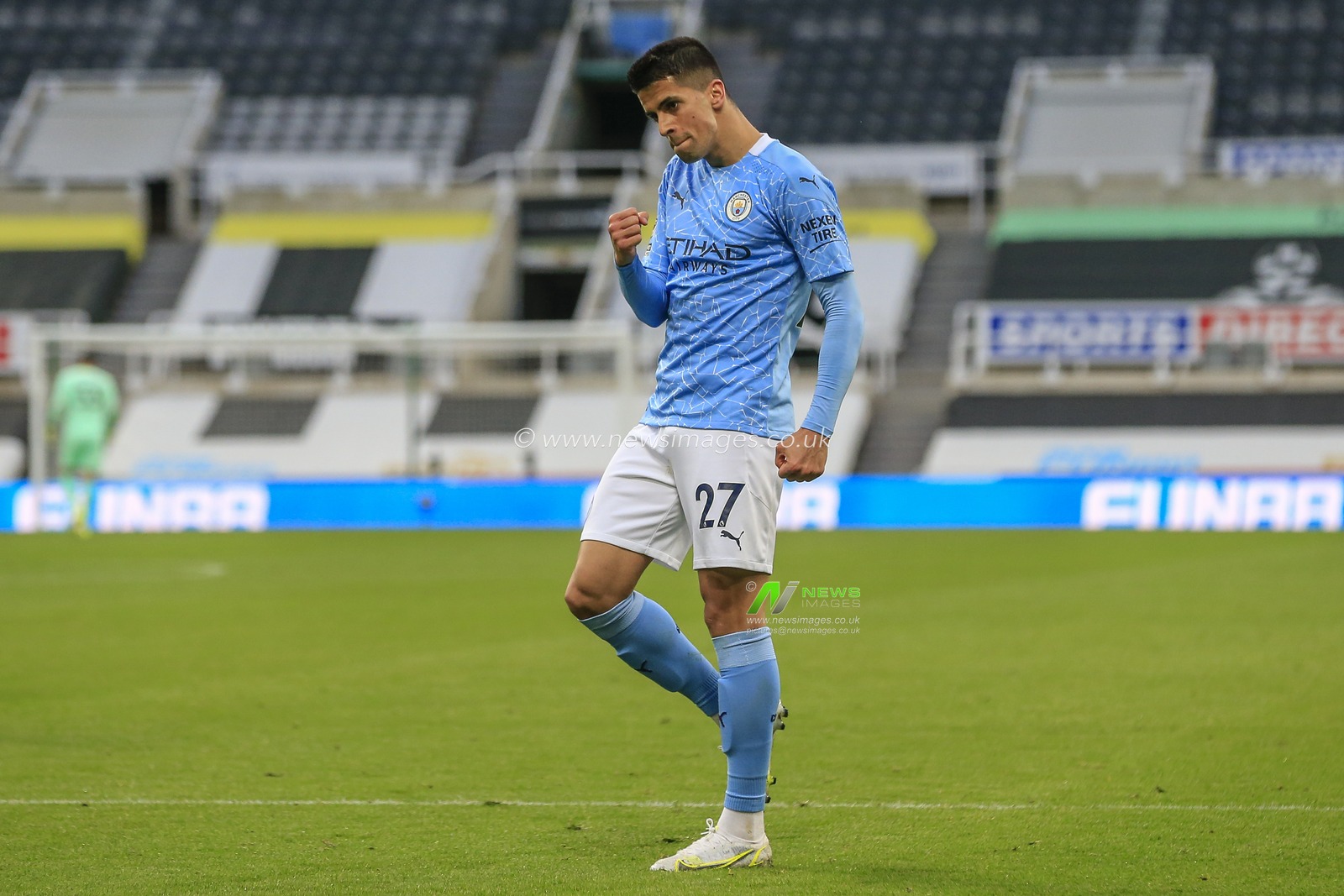 JoÃ£o Cancelo #27 of Manchester City celebrates his goal to make it 1-1