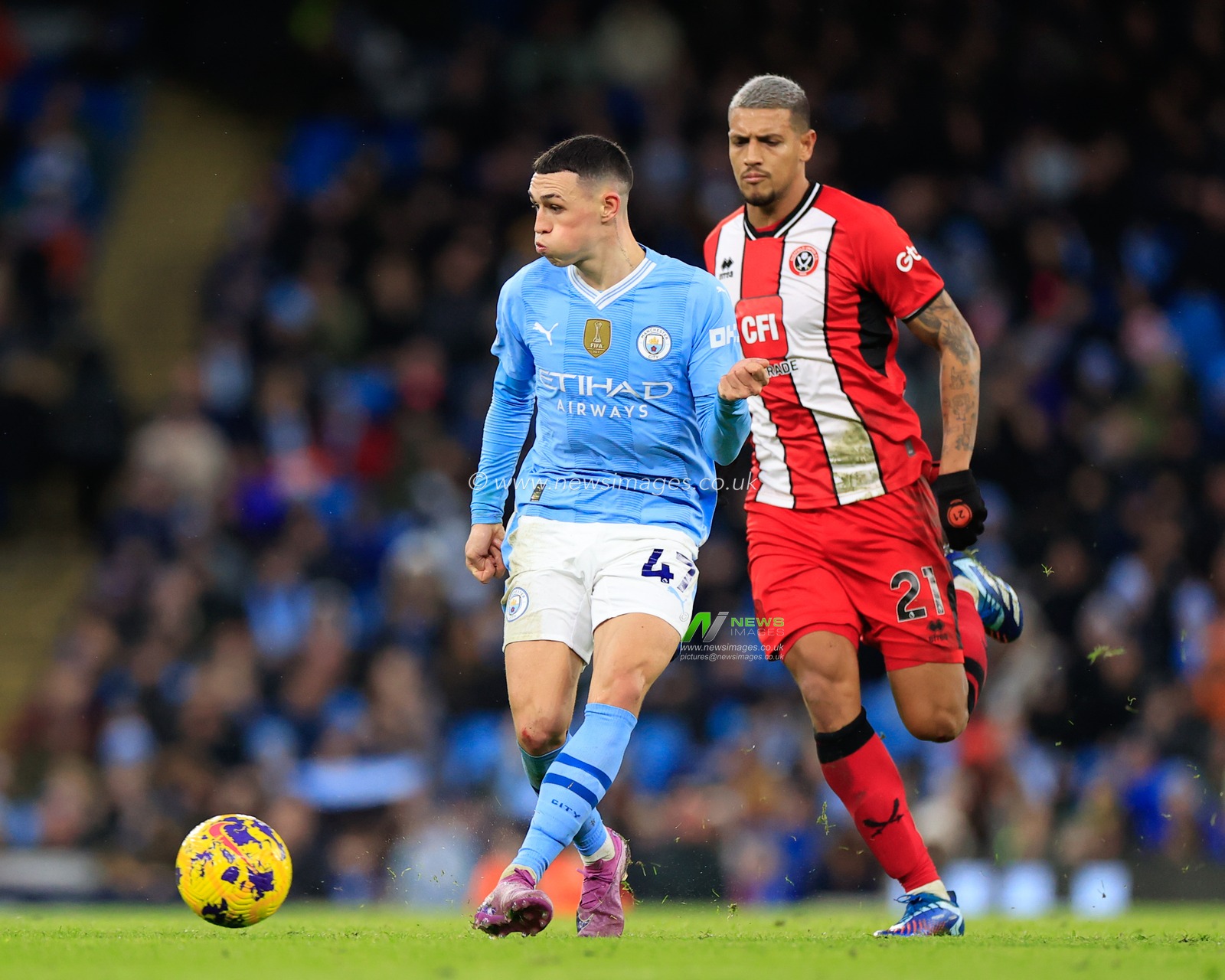 Phil Foden of Manchester City passes the ball, during the Premier League match Manchester City vs Sheffield United at Etihad Stadium, Manchester, United Kingdom, 30th December 2023

(Photo by Conor Molloy/News Images)