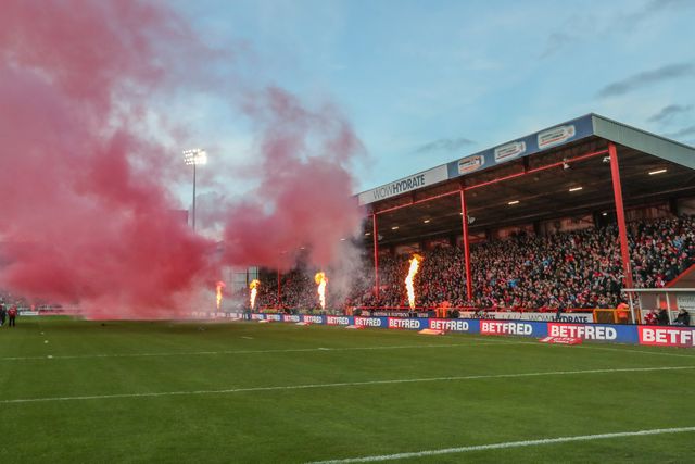 Pyrotechnics as the teams come out for the game during the Betfred Super League Round 9 match Hull KR vs Wigan Warriors at Sewell Group Craven Park, Kingston upon Hull, United Kingdom, 26th April 2024

(Photo by Alfie Cosgrove/News Images)