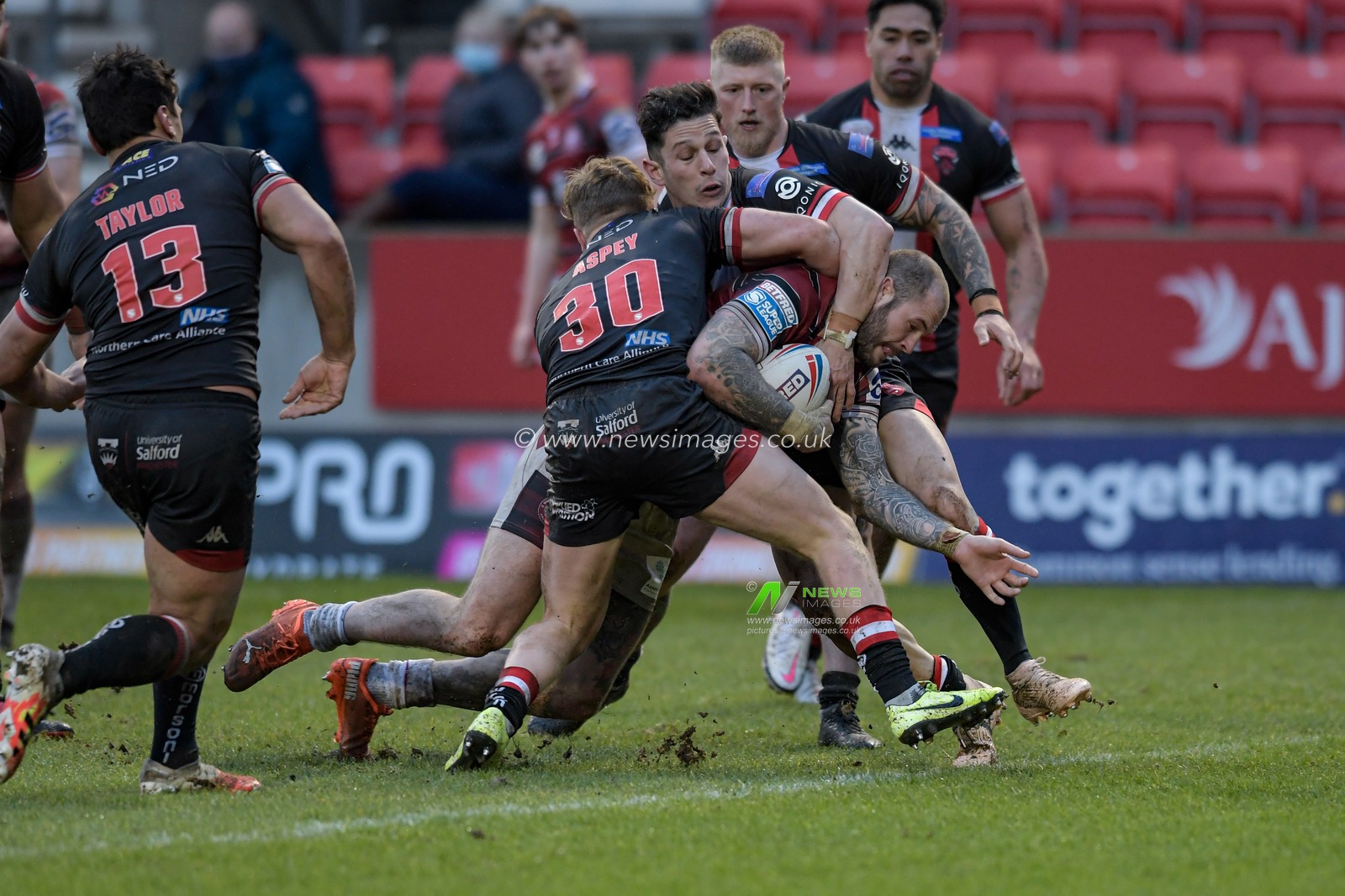 Zak Hardaker (3) of Wigan Warriors is held up while attempting to score a try