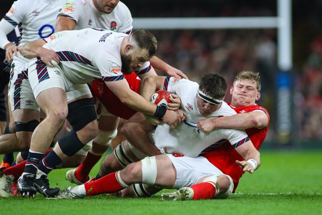 Tom Curry of England is tackled by Jac Morgan of Wales during the 2025 Guinness 6 Nations match Wales vs England at Principality Stadium, Cardiff, United Kingdom, 15th March 2025

(Photo by Andrew Lewis/News Images)