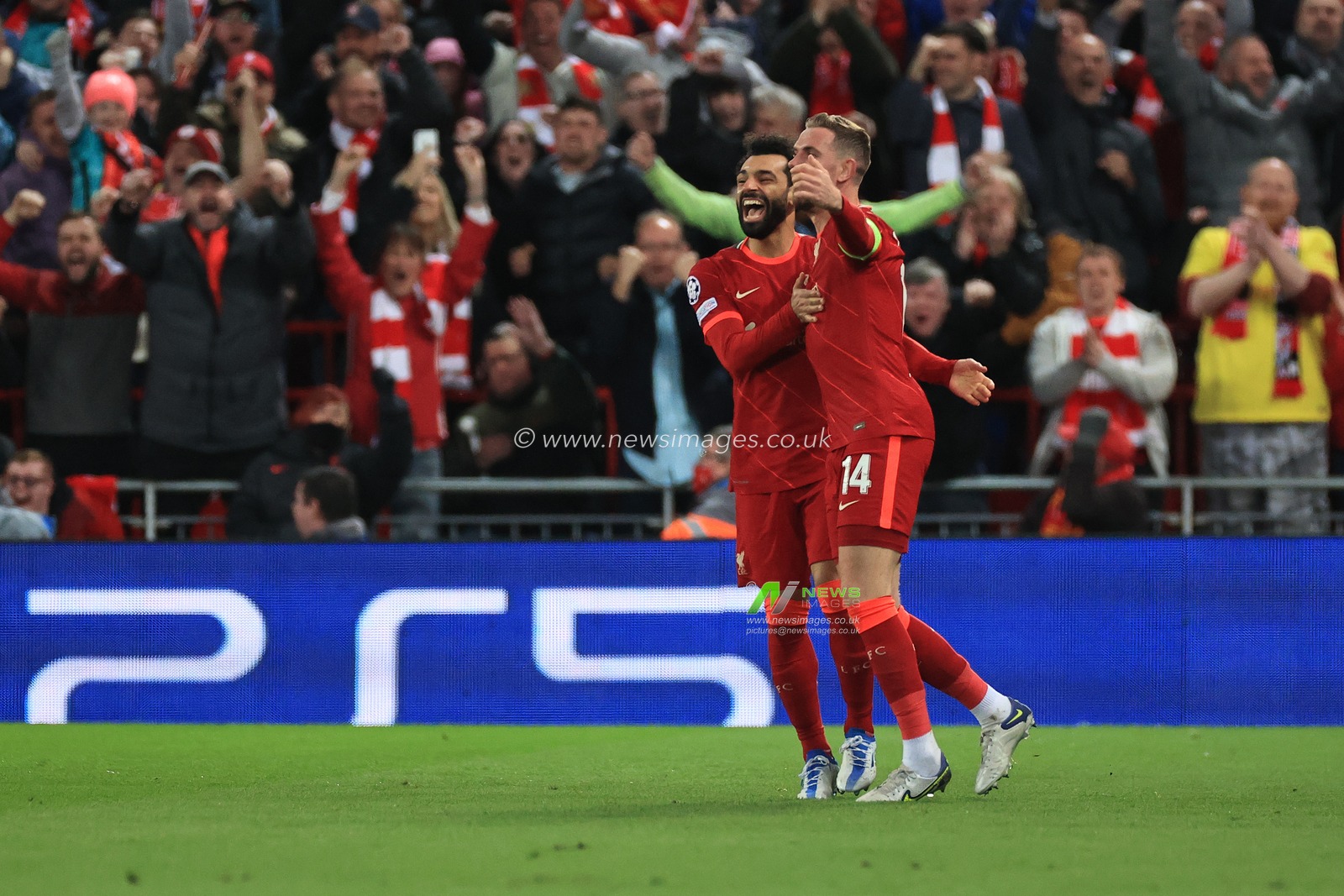 Jordan Henderson #14 of Liverpool celebrates scoring the opening goal