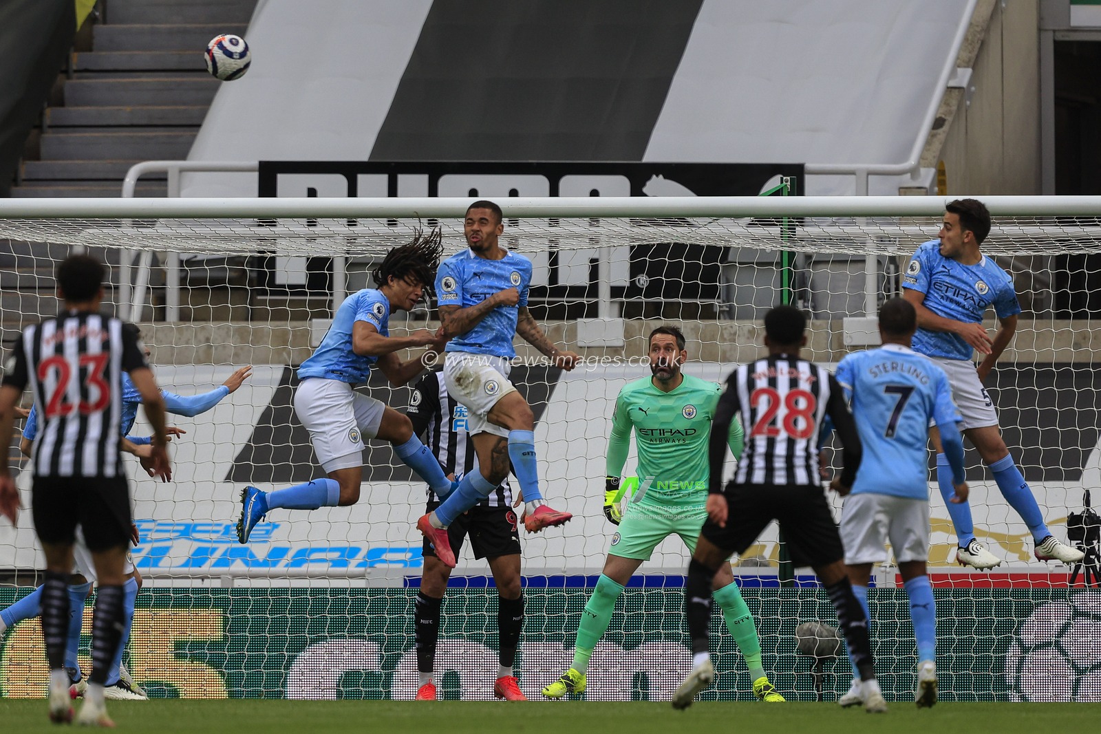 Gabriel Jesus #9 of Manchester City heads the ball clear of the Manchester City penalty area